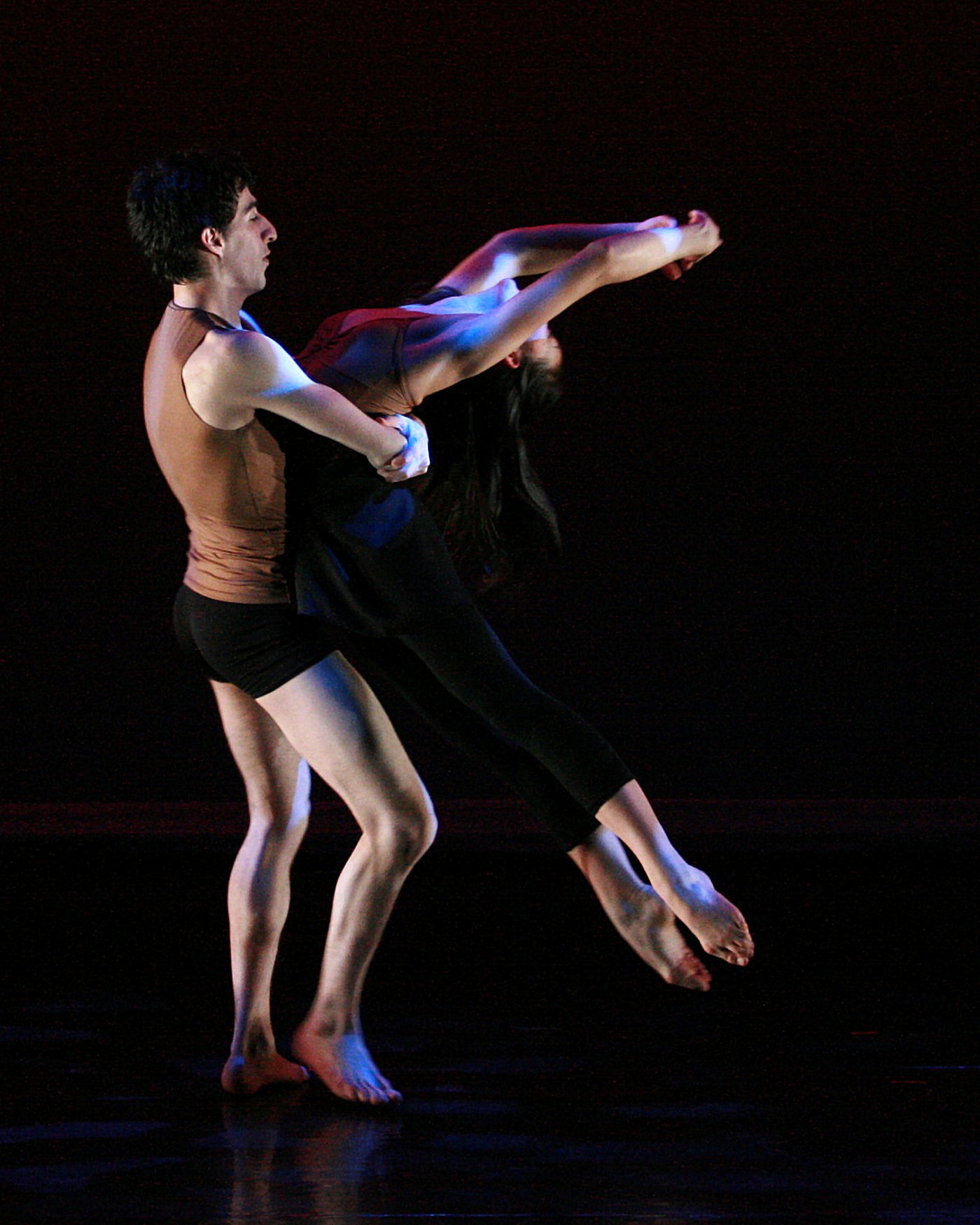 A duet on a darkened stage