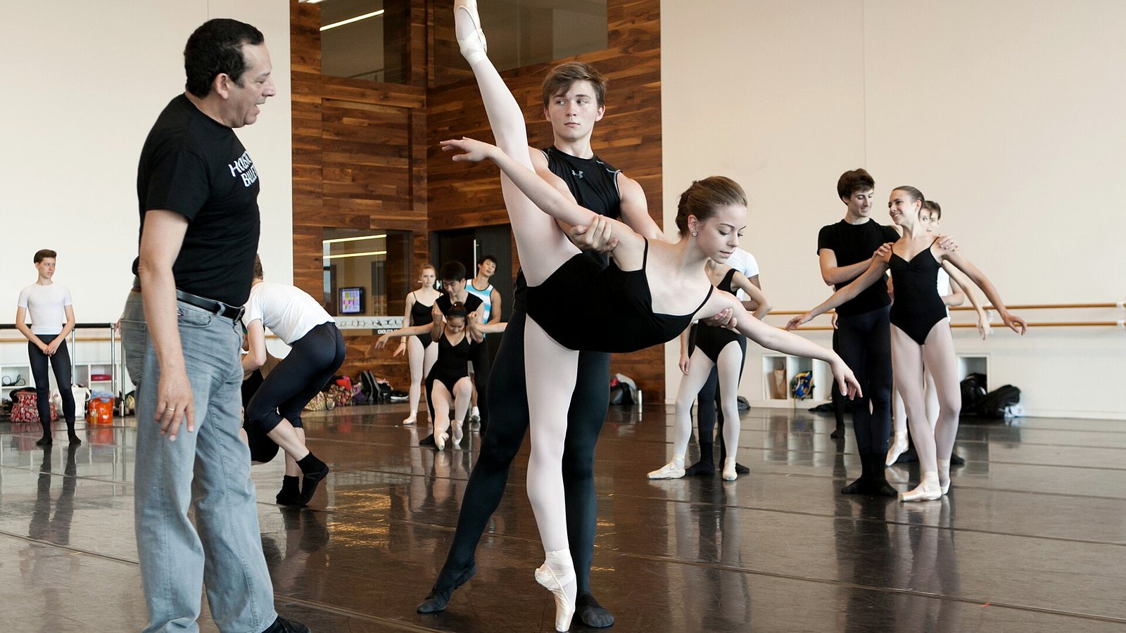 A rehearsal in progress in a dance studio