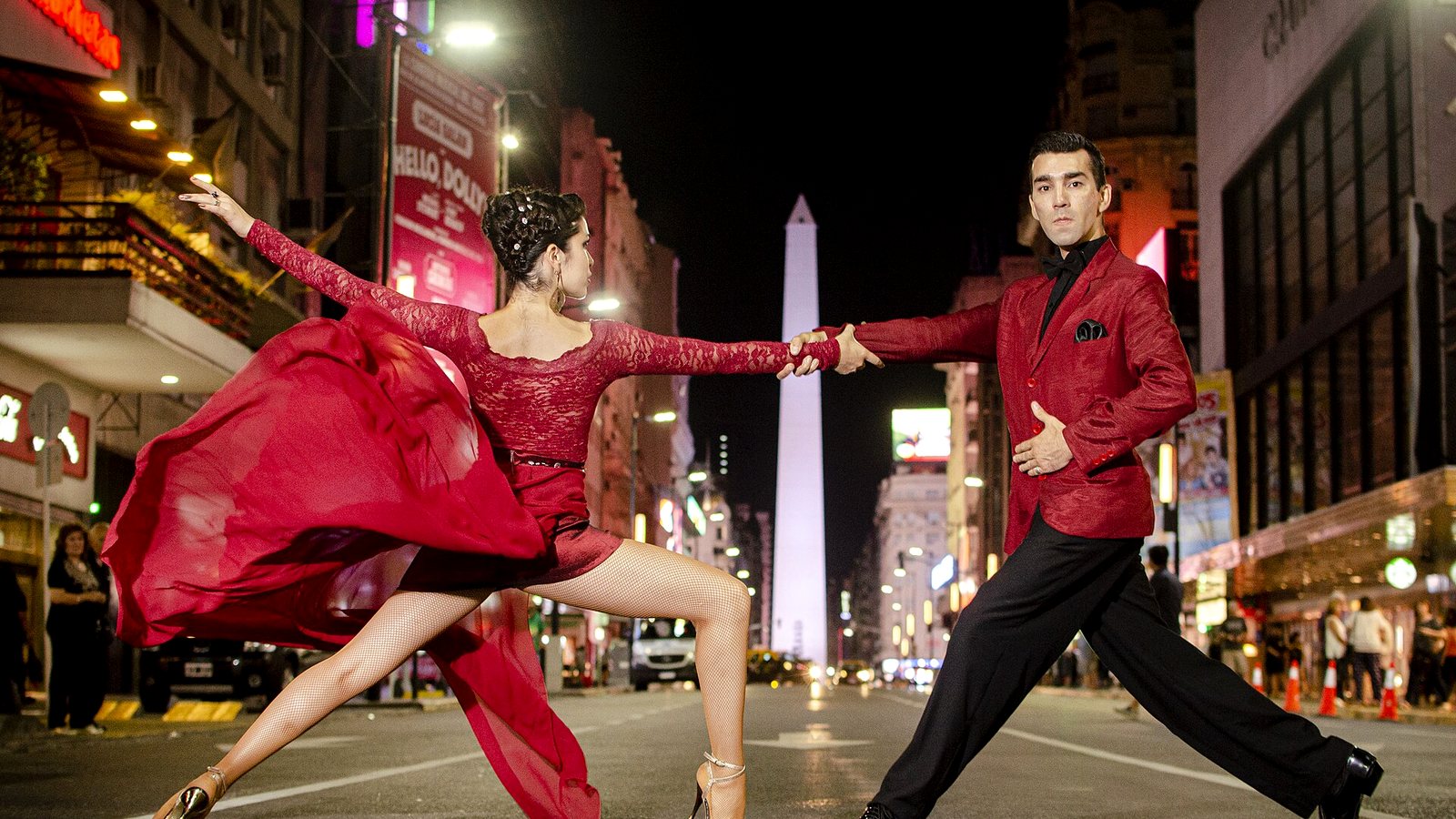 A tango couple dancing in the street
